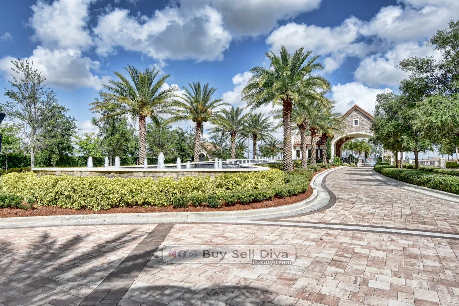 MiraLago at Parkland gatehouse and grand entry with palm-lined paver driveway